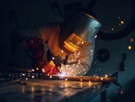 Man,Worker,Working,With,A,Metal,Product,And,Welding,It