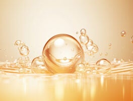 Golden yellow abstract oil bubbles or face serum background. Oil and water bubbles .golden yellow Bubbles oil or collagen serum for cosmetic product,