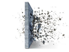 Concrete,Wall,On,A,White,Background,Shatters,Into,The,Pieces,
